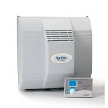 an aprilaire 700 power flow through humidifier shown as a white unit with vents on the front and a separate controller panel