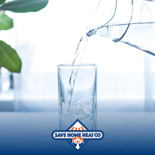 a water pitcher pouring water into a glass