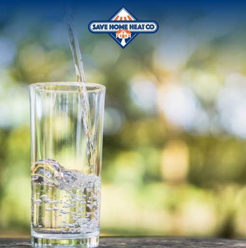 clean water being poured into a clear glass