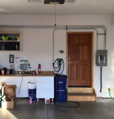 home garage with a ev charger on the wall