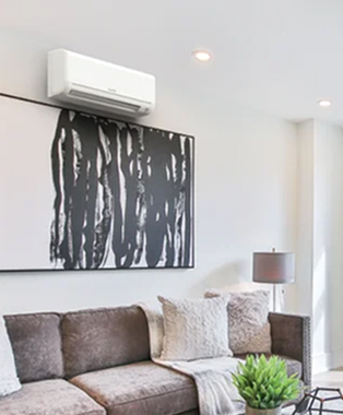 an indoor mini split blower unit on a wall