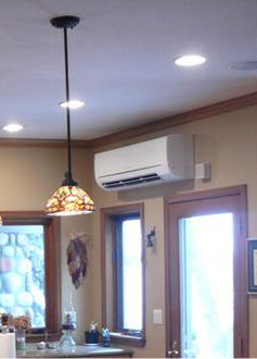 an indoor blower hvac unit on a wall of a beige kitchen