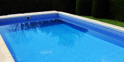 a beautiful blue rectangle in-ground swimming pool