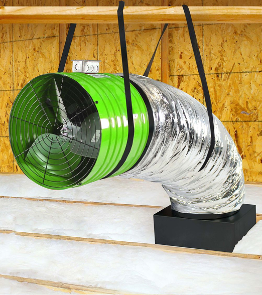 an insulated silver tube in an attic with a large green fan on the opening
