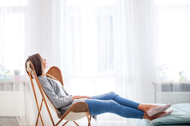 Women Relaxing on Chair at Home with Great Air Quality